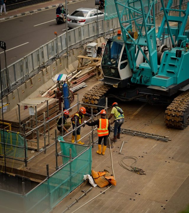 blue tipper with workers